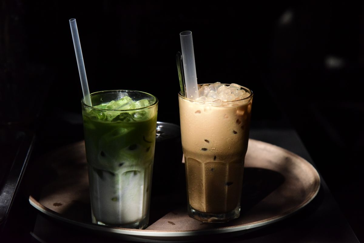 Iced milk tea and matcha served on a tray